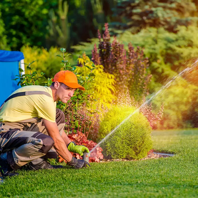 Irrigation technician working on sprinkler system